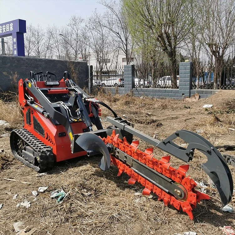 Red trencher machine with rubber tracks on a dirt field