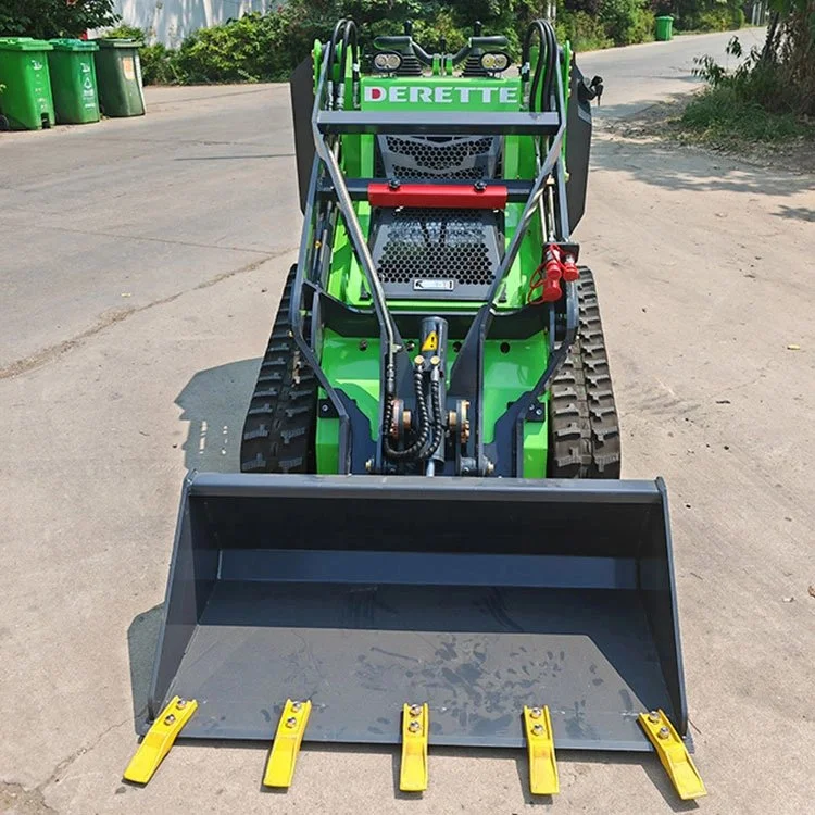 Green mini skid steer loader with hydraulic attachments on a street