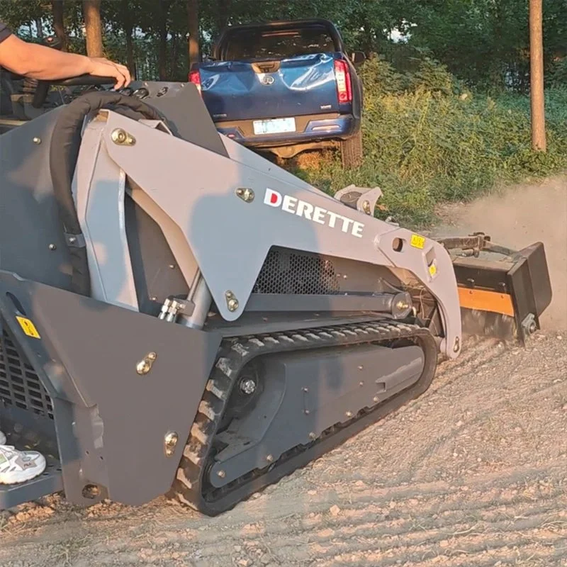 Skid steer loader clearing dirt with a blue pickup truck in the background.