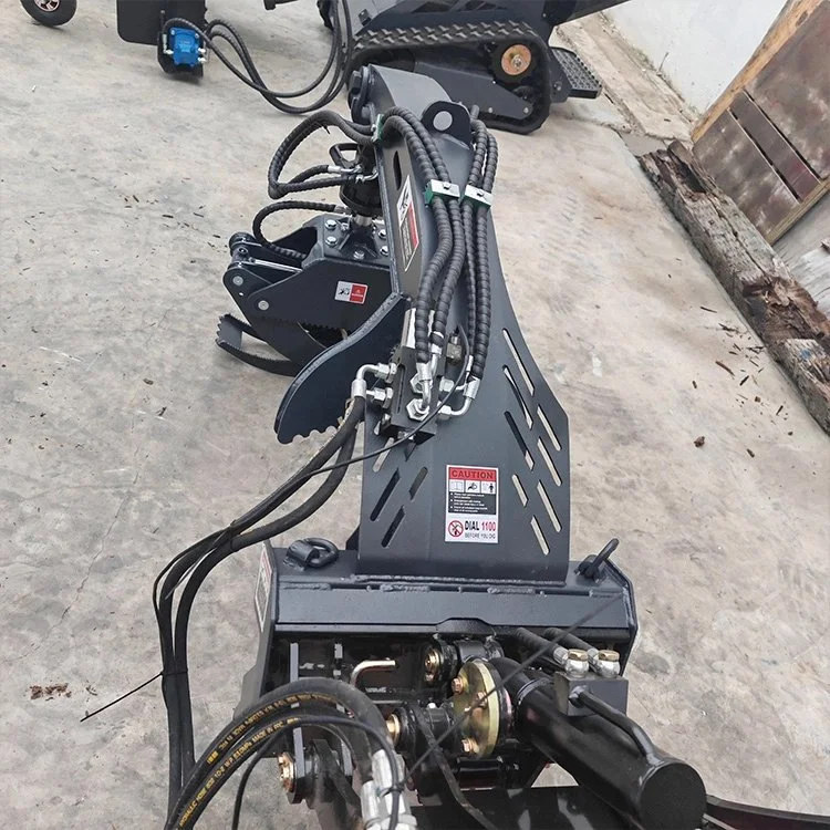 heavy machinery hydraulic attachment on concrete floor