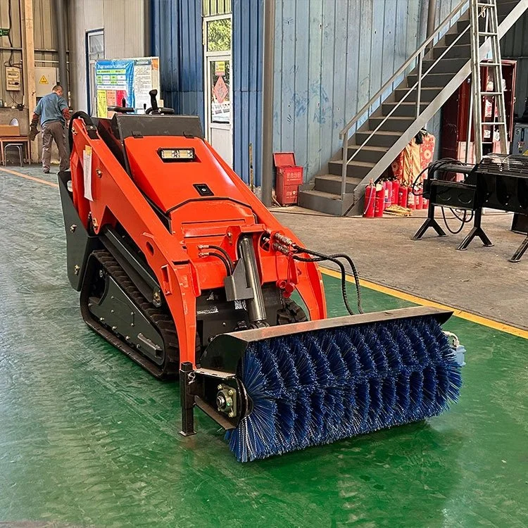 Industrial cleaning machine with blue brush attachment in a workshop.