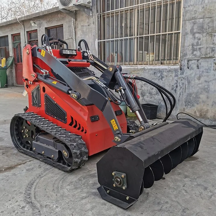 Red skid steer loader with auger attachment on concrete surface