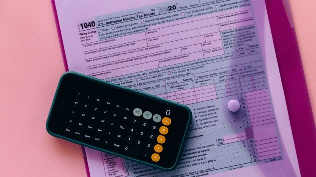 Tax forms and calculator representing property tax planning for Mansfield homeowners.