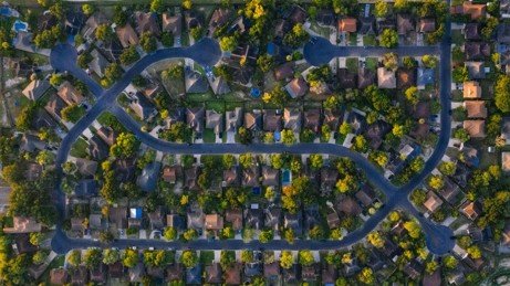 Aerial view of a suburban residential neighborhood representing Mansfield HOA communities.