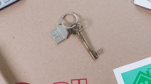 House key and moving supplies representing a Mansfield homeowner claiming a homestead exemption.