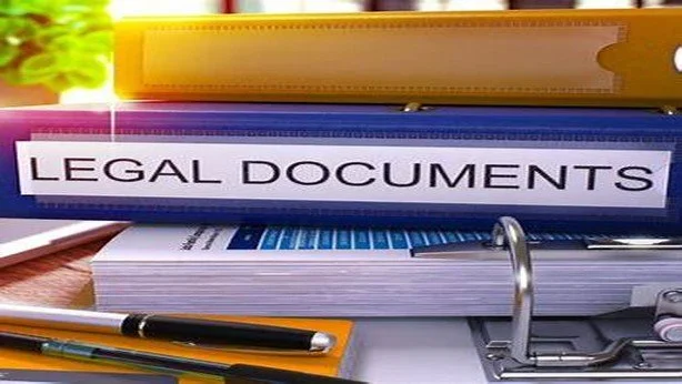 House keys and real estate documents representing probate and inherited property paperwork.