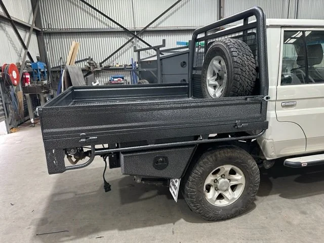 White ute with a black utility bed, custom ute tray and powder coating Wagga Wagga. Sandblasting and powder coating service Wagga with custom truck and ute bodies and ute trays. 