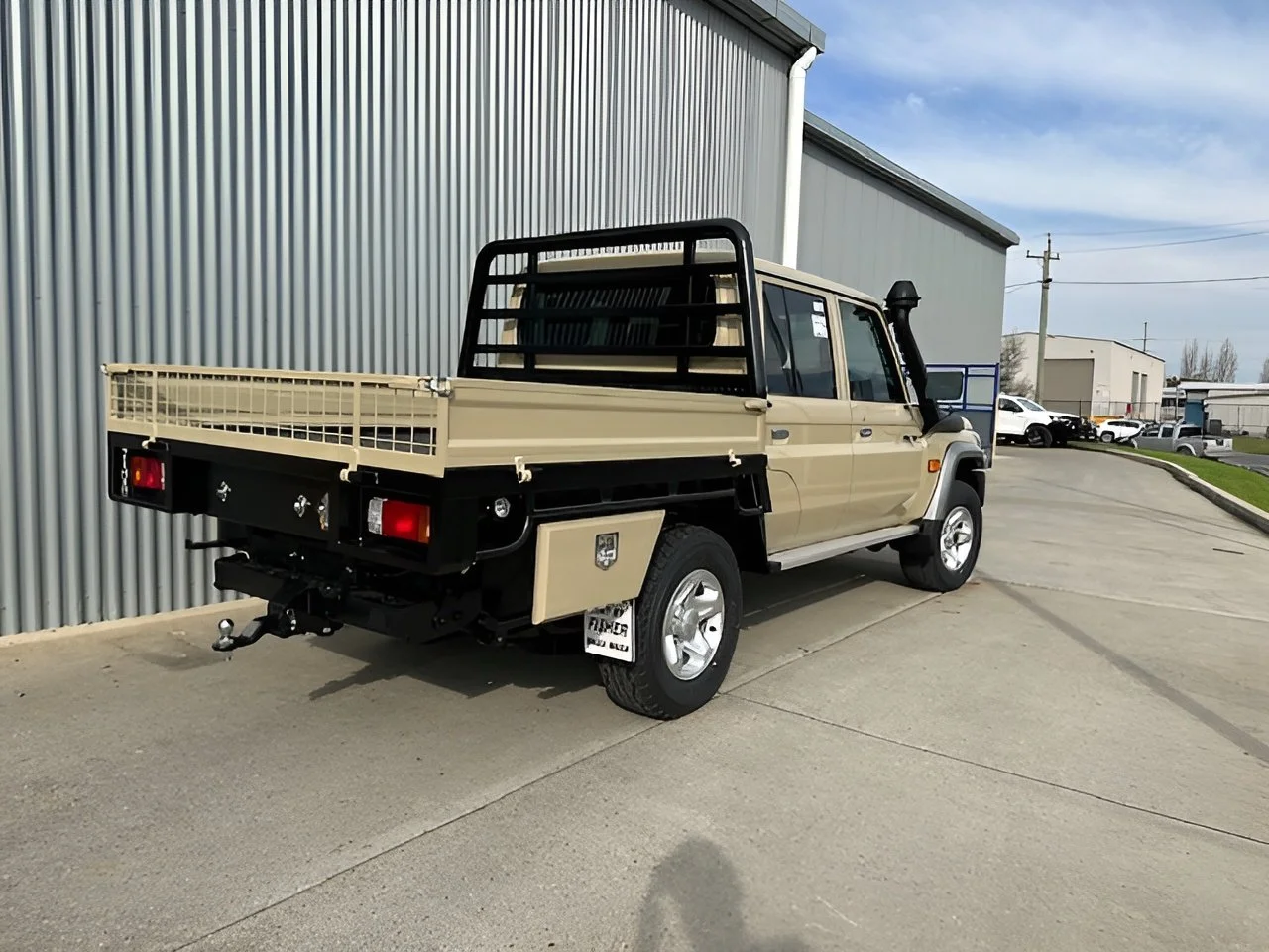 Beige and black flatbed ute, custom fabricated ute tray flatbed. Powder coated and sandblasted, and installed. Custom designed and welded ute trays in Wagga Wagga