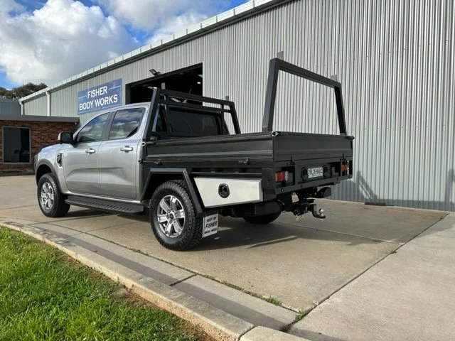 Silver ute with an open cargo bed, custom ute tray and powder coating Wagga Wagga. Sandblasting and powder coating service Wagga with custom truck and ute bodies and ute trays. 