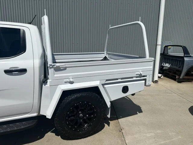 White ute with a flatbed, custom ute tray and powder coating Wagga Wagga. Sandblasting and powder coating service Wagga with custom truck and ute bodies and ute trays. 