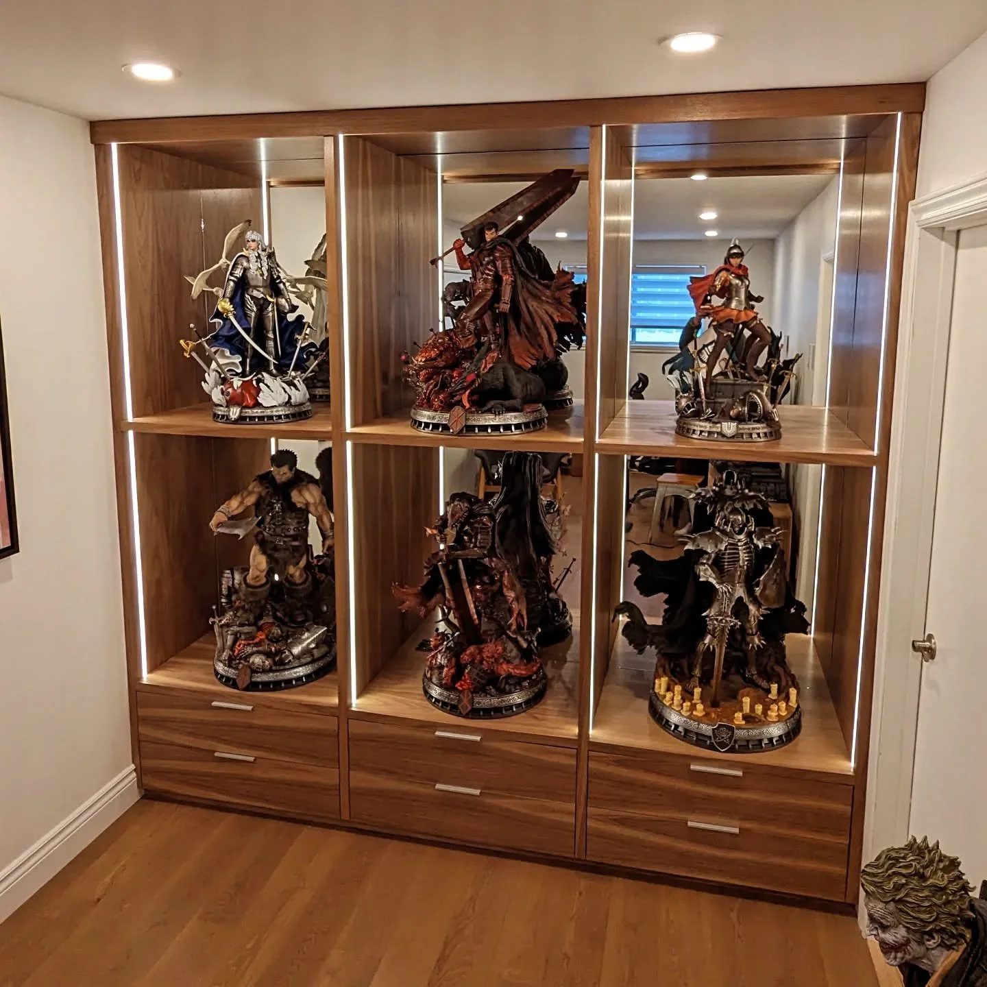 Enjoy this Custom #berserk Display unit made with walnut! 
Intergrated led and custom sized mirror back panel.

Contact @lashopwudwork for your next bespoke furniture! 
.
.
.
.
.
#woodworking #handtools #wood #woodworkers #custombuilt #diy #carpenter