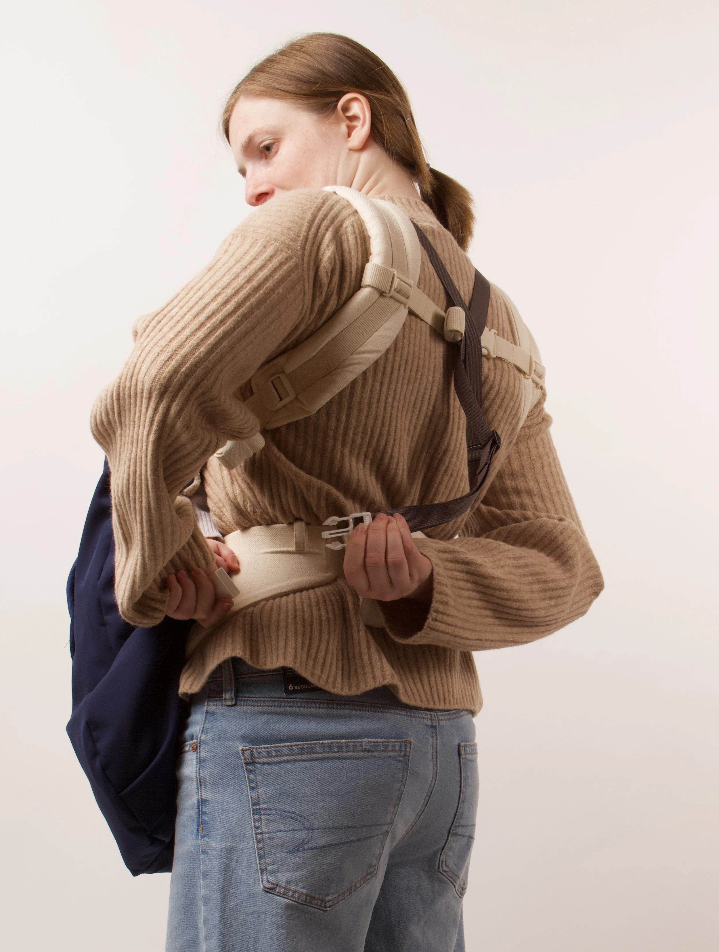 Pull towards bottom buckle near your waist