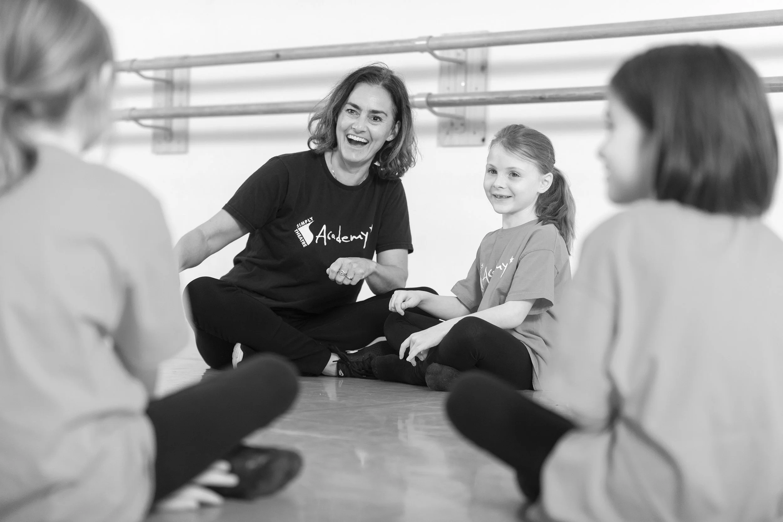 A theatre rehearsal with smiling young children