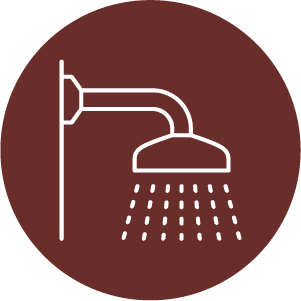 Lin drawing of a shower head with water coming out on a red circle