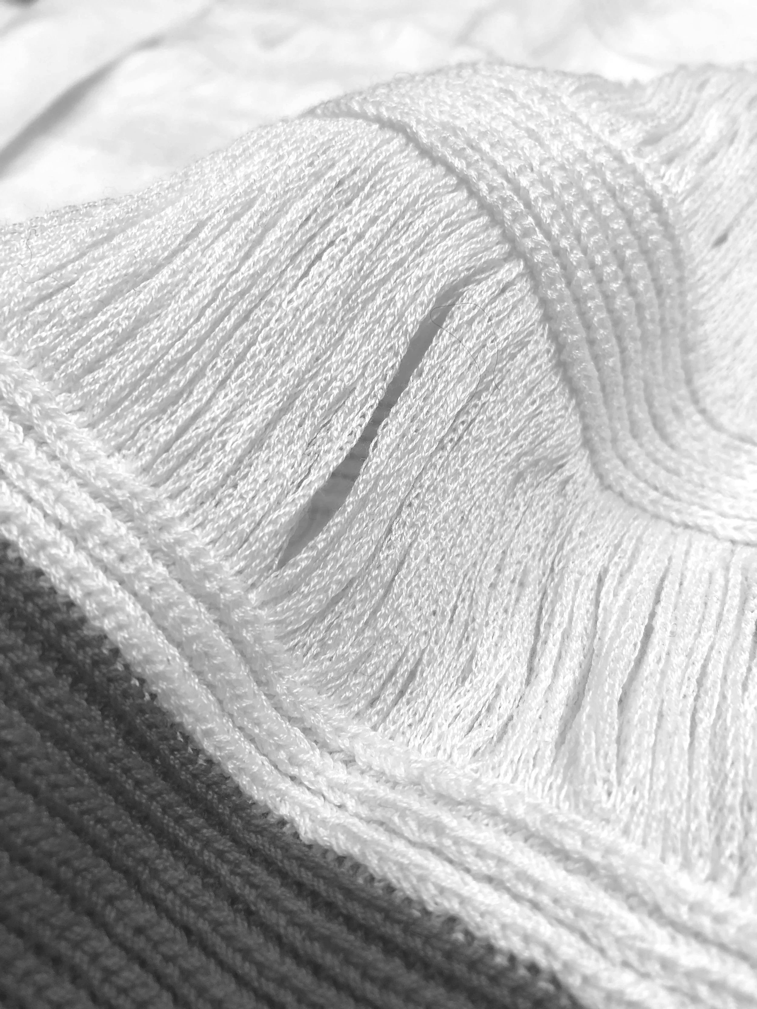 Close-up of white float knit construction.