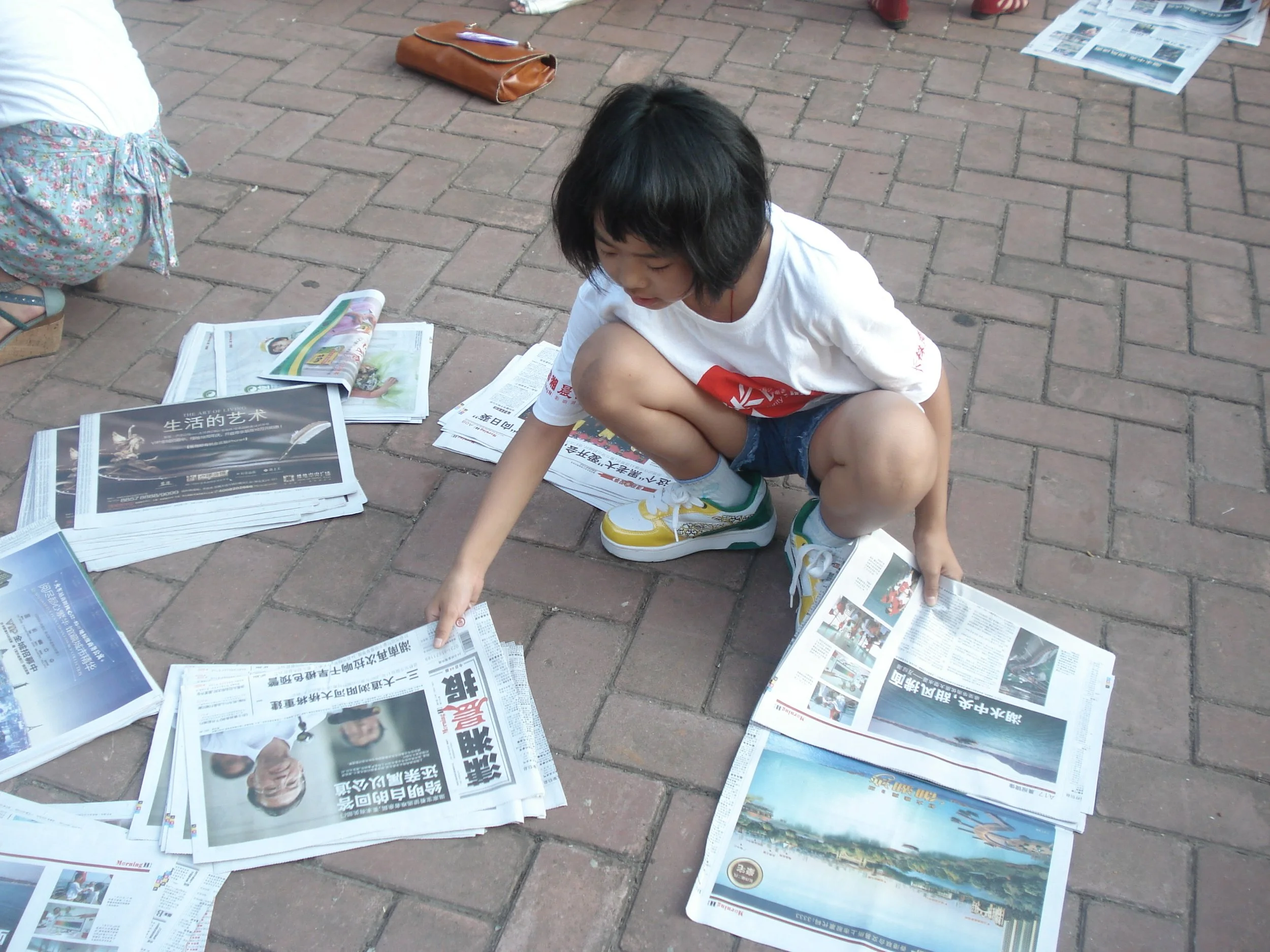 me selling newspaper.JPG
