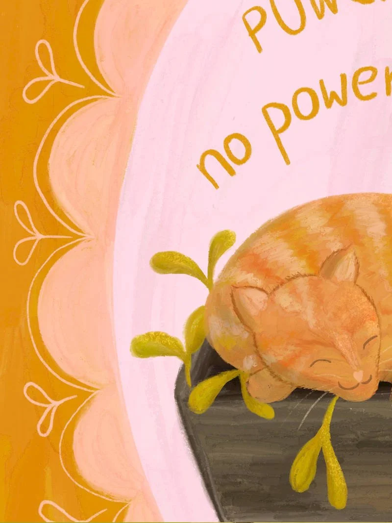 Detail of a cosy illustrated art print featuring a ginger cat curled up asleep in a wooden planter box, set in a scalloped pink oval with the words "Power Nap – no power. just nap."
