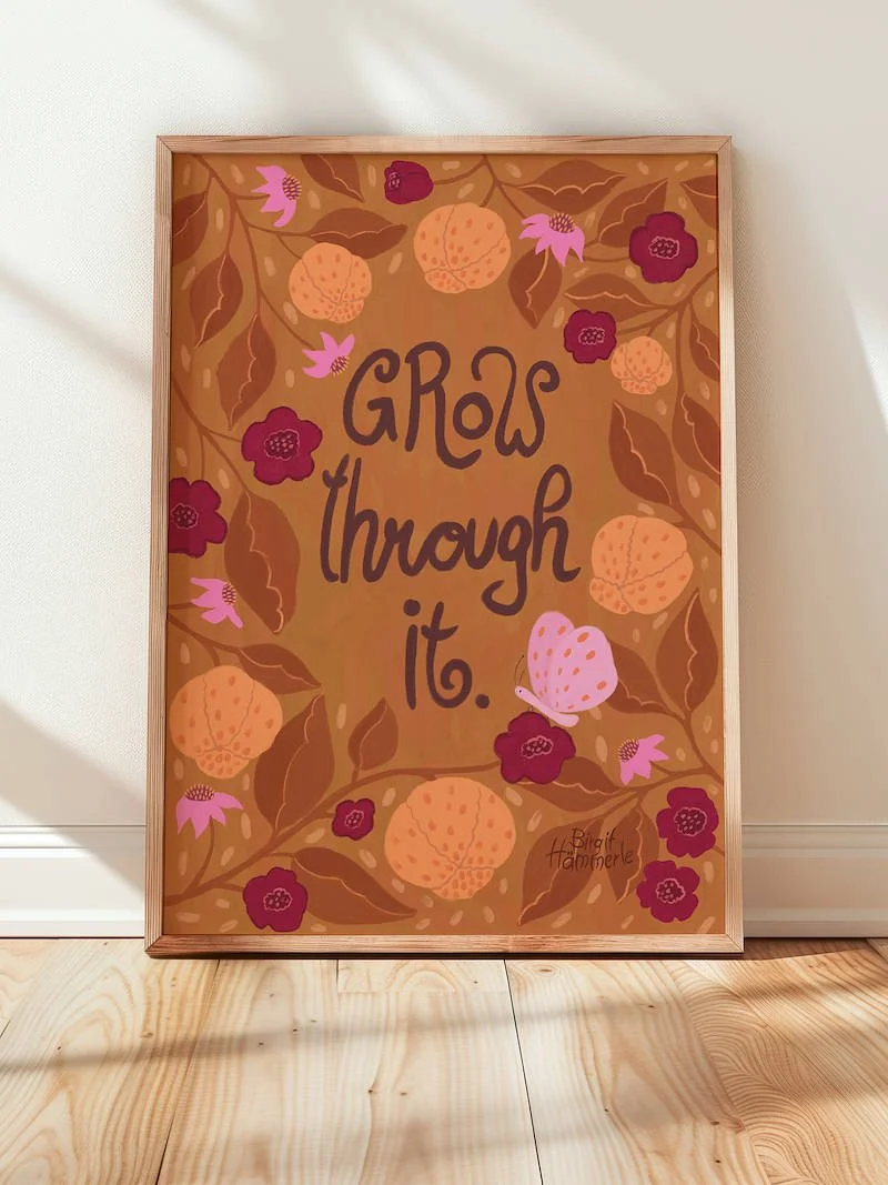 Art print in autumn colours with a quote "Grow Through It" surrounded by leaves and fruit and a butterfly.