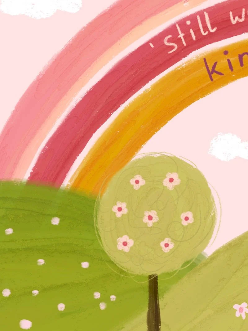 Detail of a whimsical art print showing rolling green hills with flowering trees beneath a rainbow, with the hand-lettered text "Be Fabulous – but in a 'still wearing slippers' kind of way."
