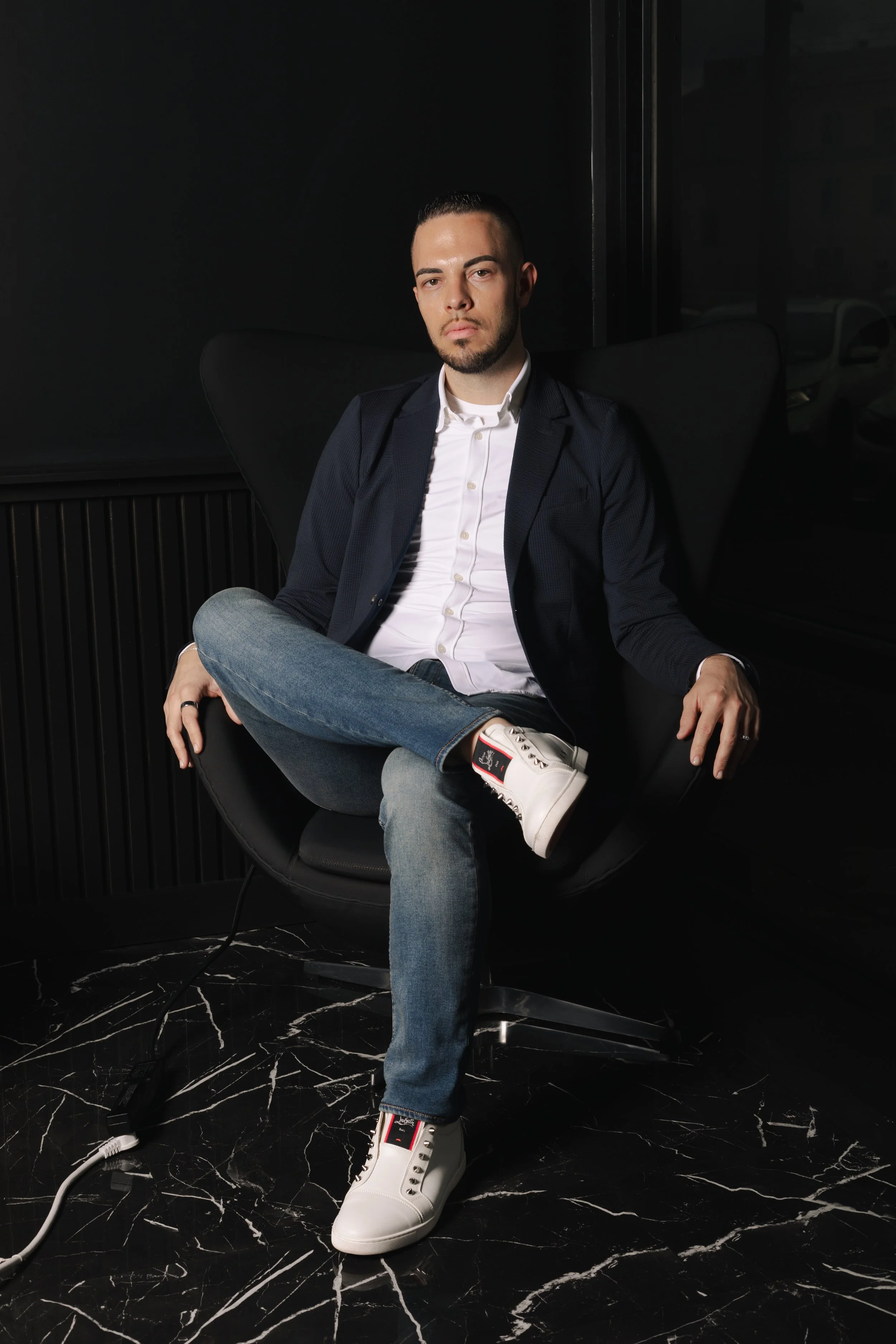 Tyler Young, founder of Click Command Co., seated in Silk Utica.