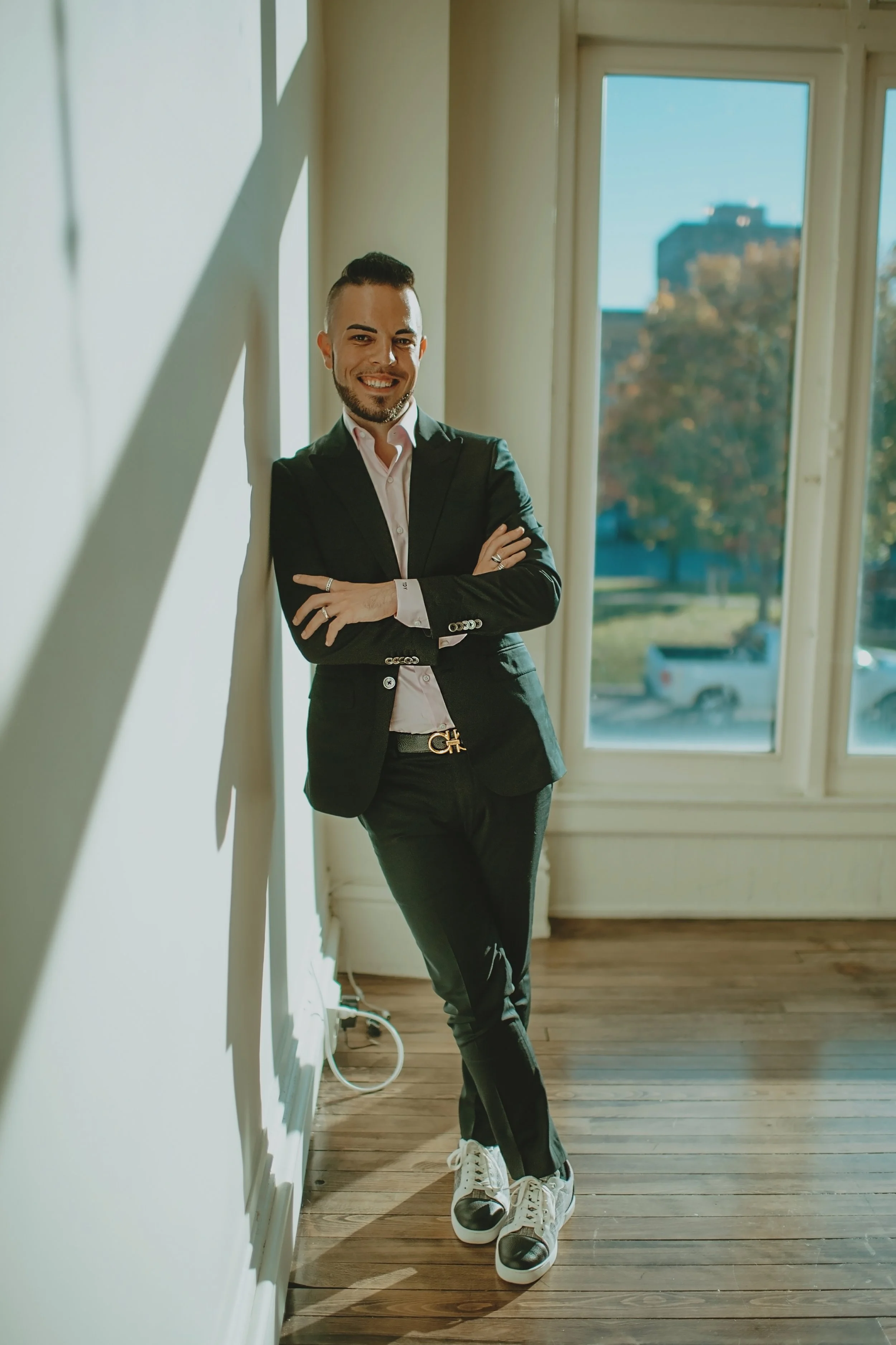 Tyler Young, founder of Click Command Co., leaning against a wall.