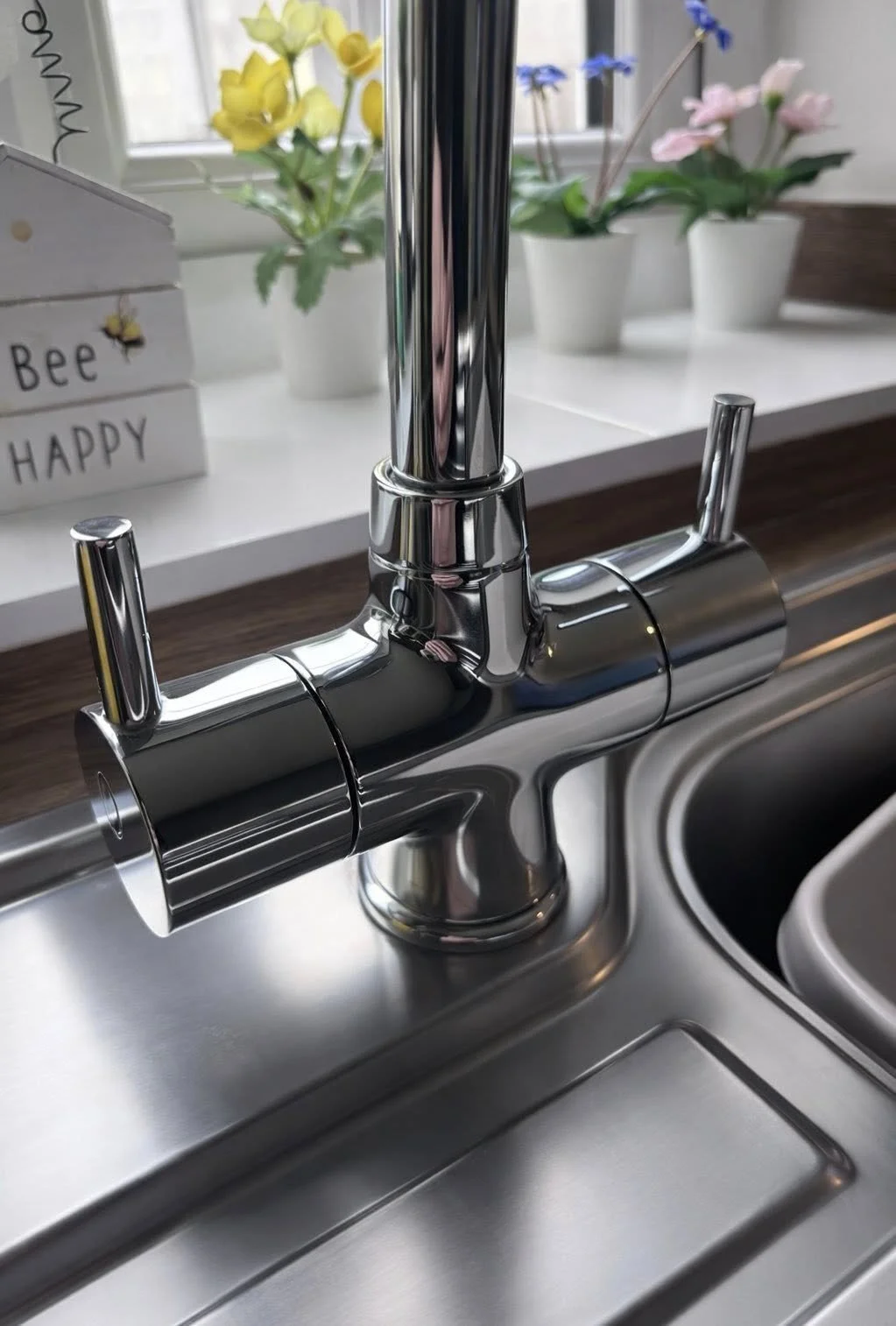 Close-up of shinykitchen taps in a residential home cleaned by OpalNest in Saltash