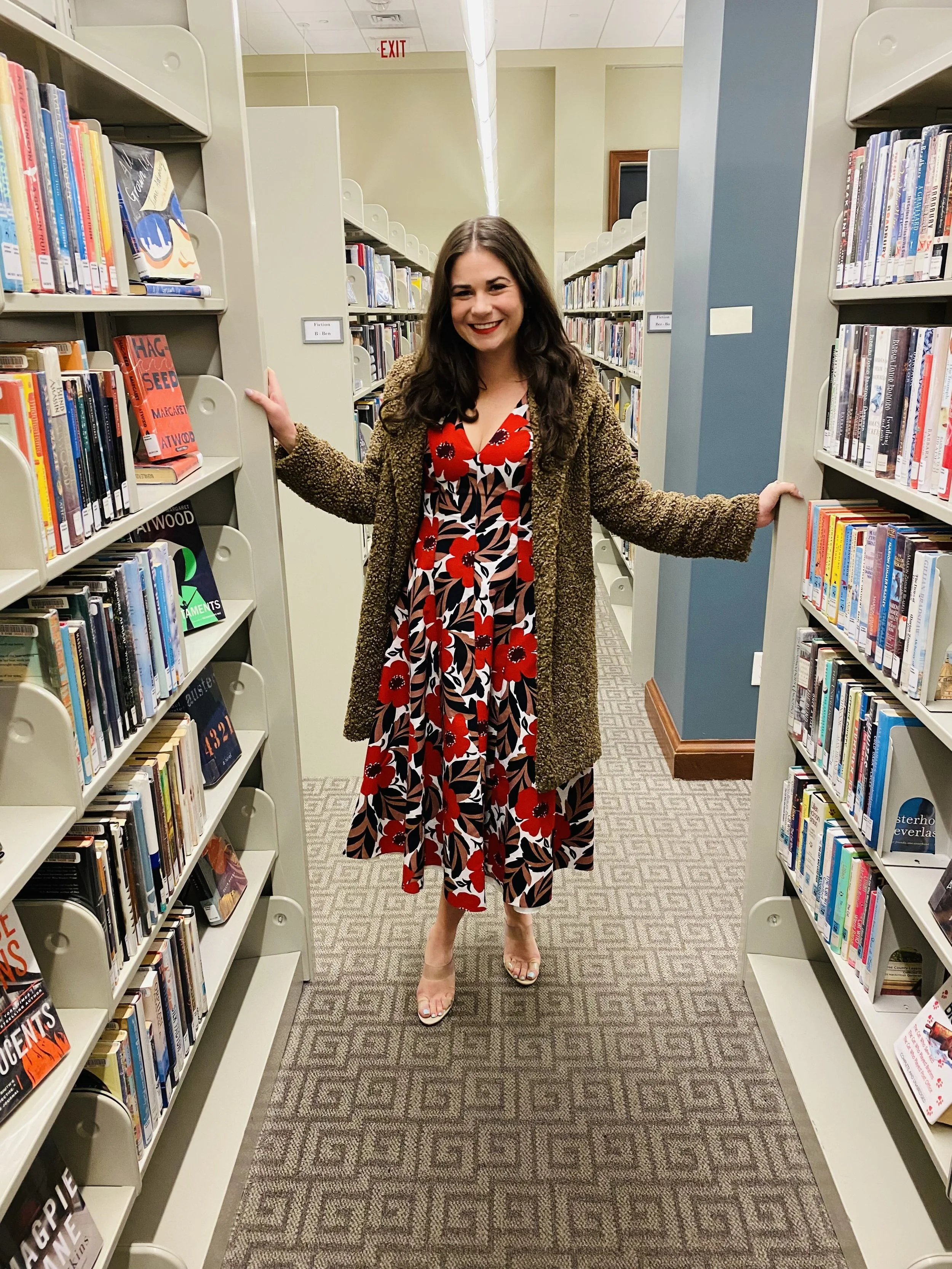 Sara Wigal standing in formal dress in Nashville Public Library