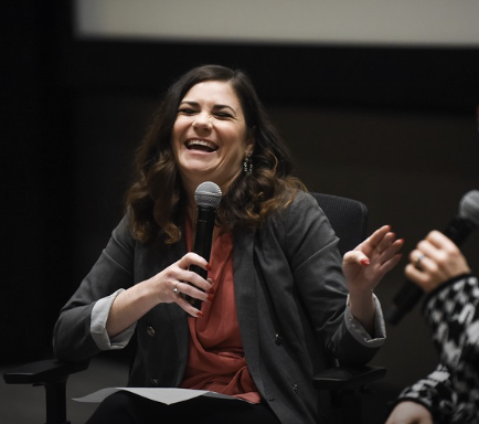 Sara Wigal emceeing an event at Belmont University