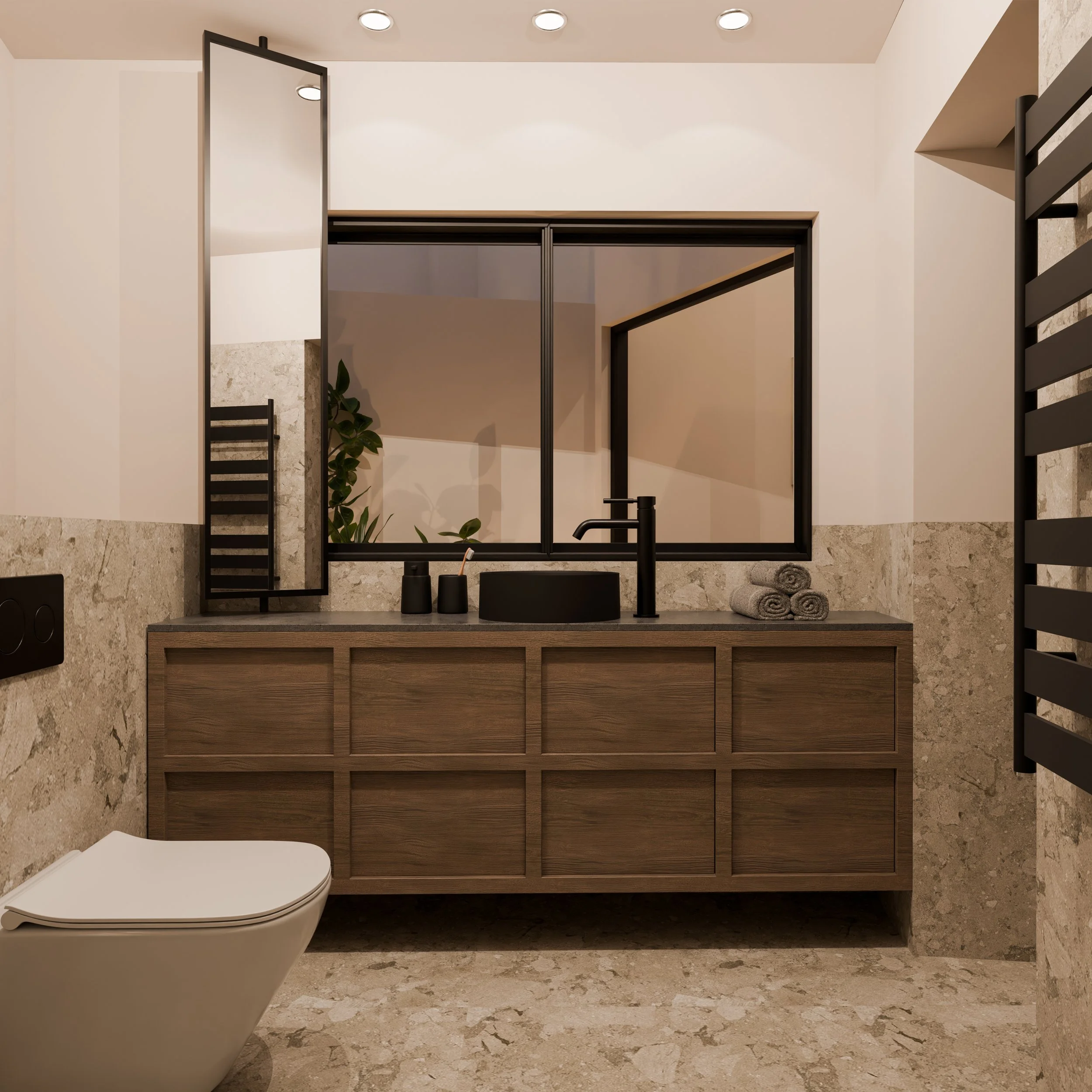 Modern bathroom with beige stone walls and floor, a wooden vanity with black sink, black faucet, and accessories, a large mirror, rolled towels, and a heated towel rail.