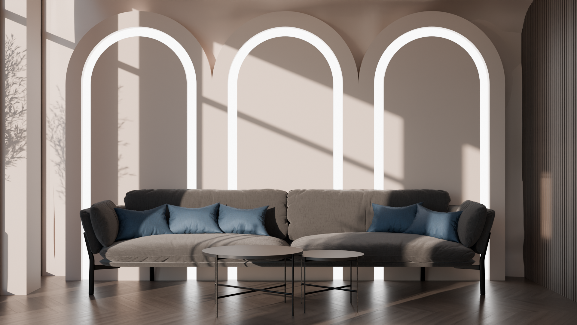 Modern living room with a beige sofa, blue pillows, two overlapping round white coffee tables, and large arched windows with natural light and shadows.