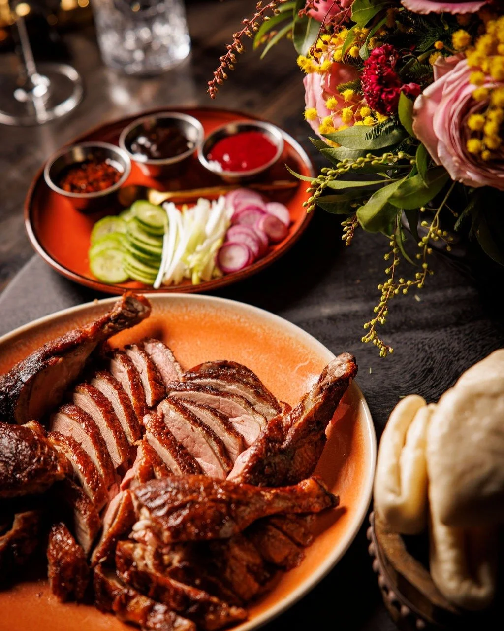 The Tea-Smoked Duck at Night Rooster 

That first bite hits with crispy skin, followed by the deep, aromatic tea smoke that clings to every tender strand of meat. It&rsquo;s rich without being heavy, fragrant without being overpowering&mdash;perfectl
