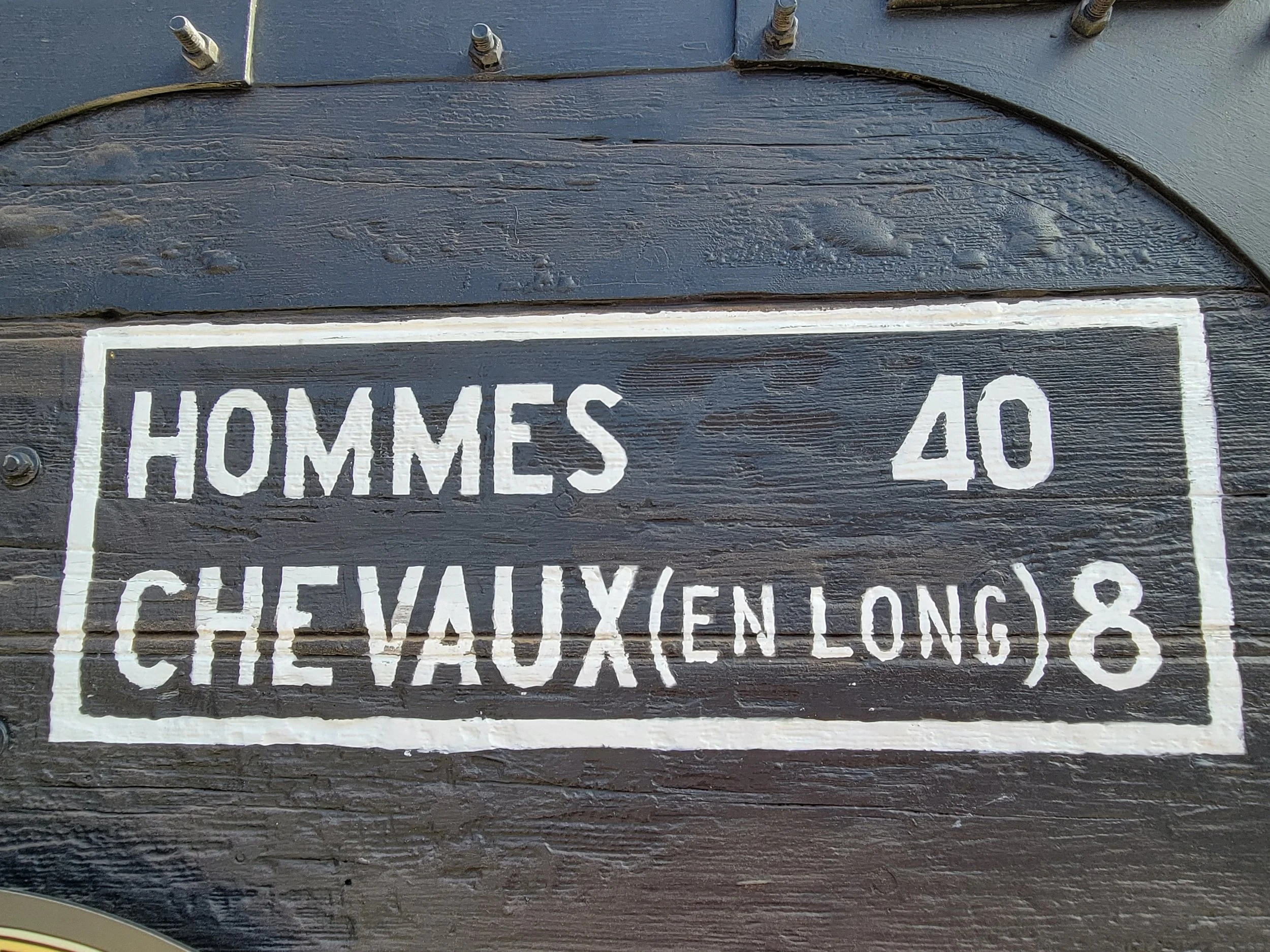 By law that had to be painted on the outside of the boxcar. The American "Doughboys" called it "40 & 8s."