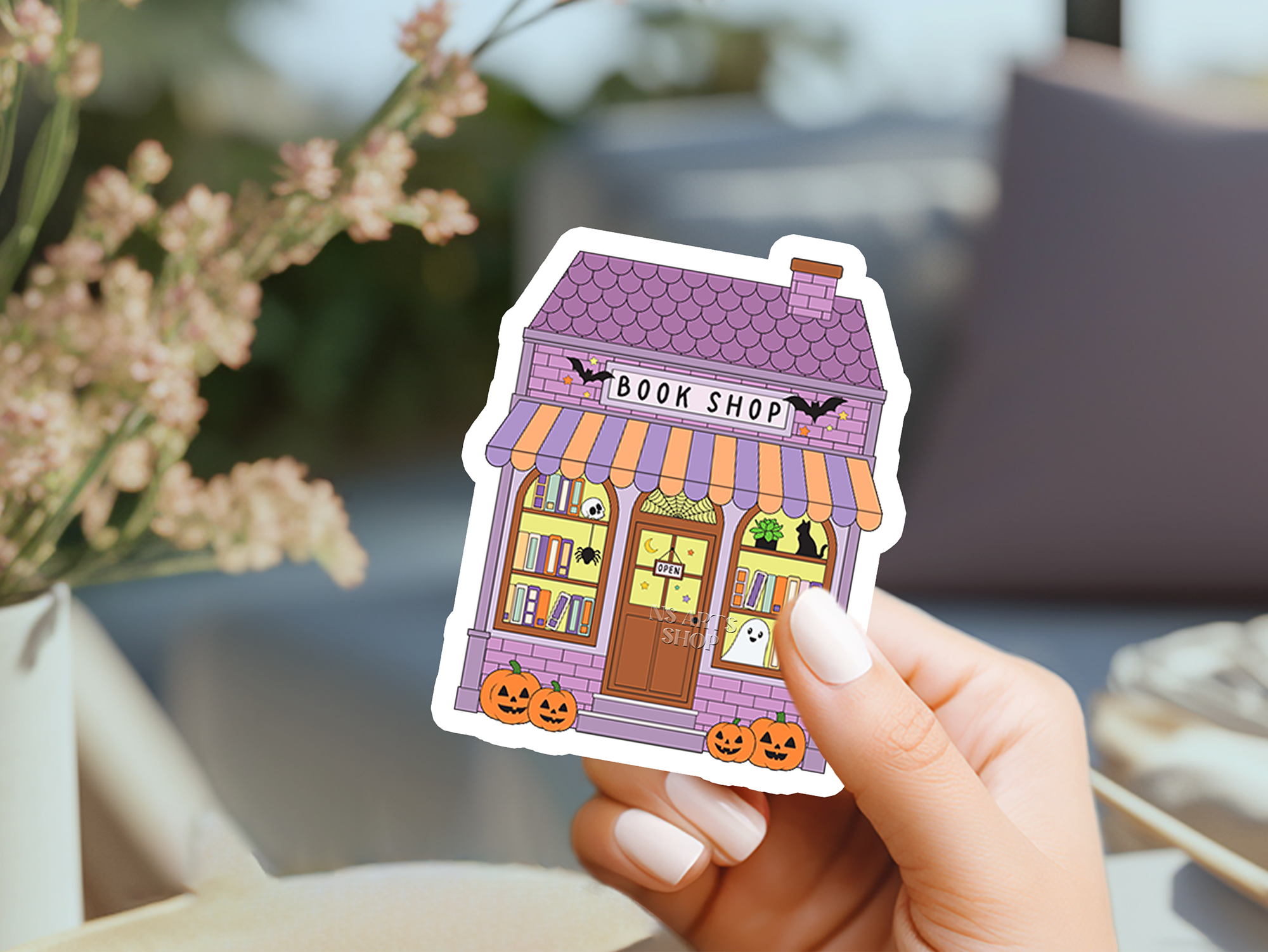 spooky-haunted-book-shop-sticker-design.png