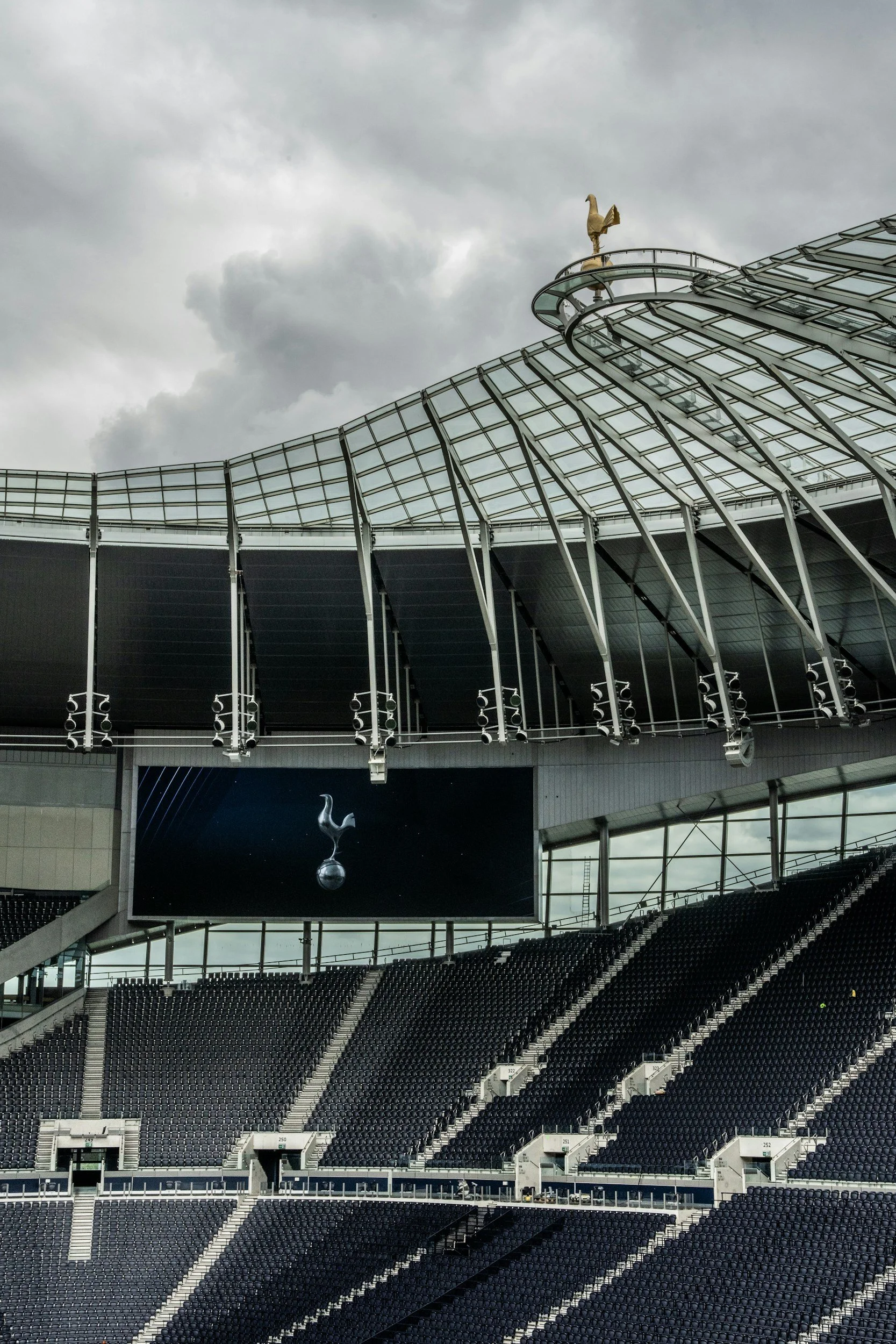 Tottenham Hotspur Stadium seating, roof structure and video screen, with Populous