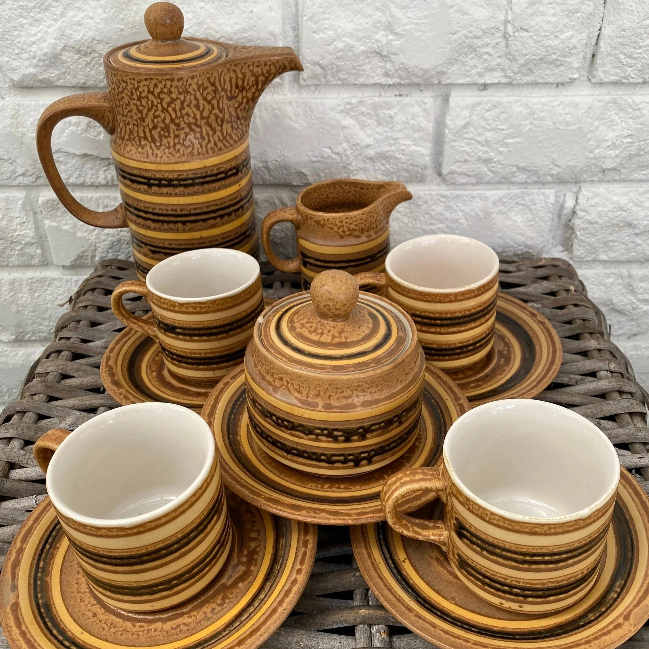 Full 15-piece 1970s Japanese coffee set arranged on wicker table
