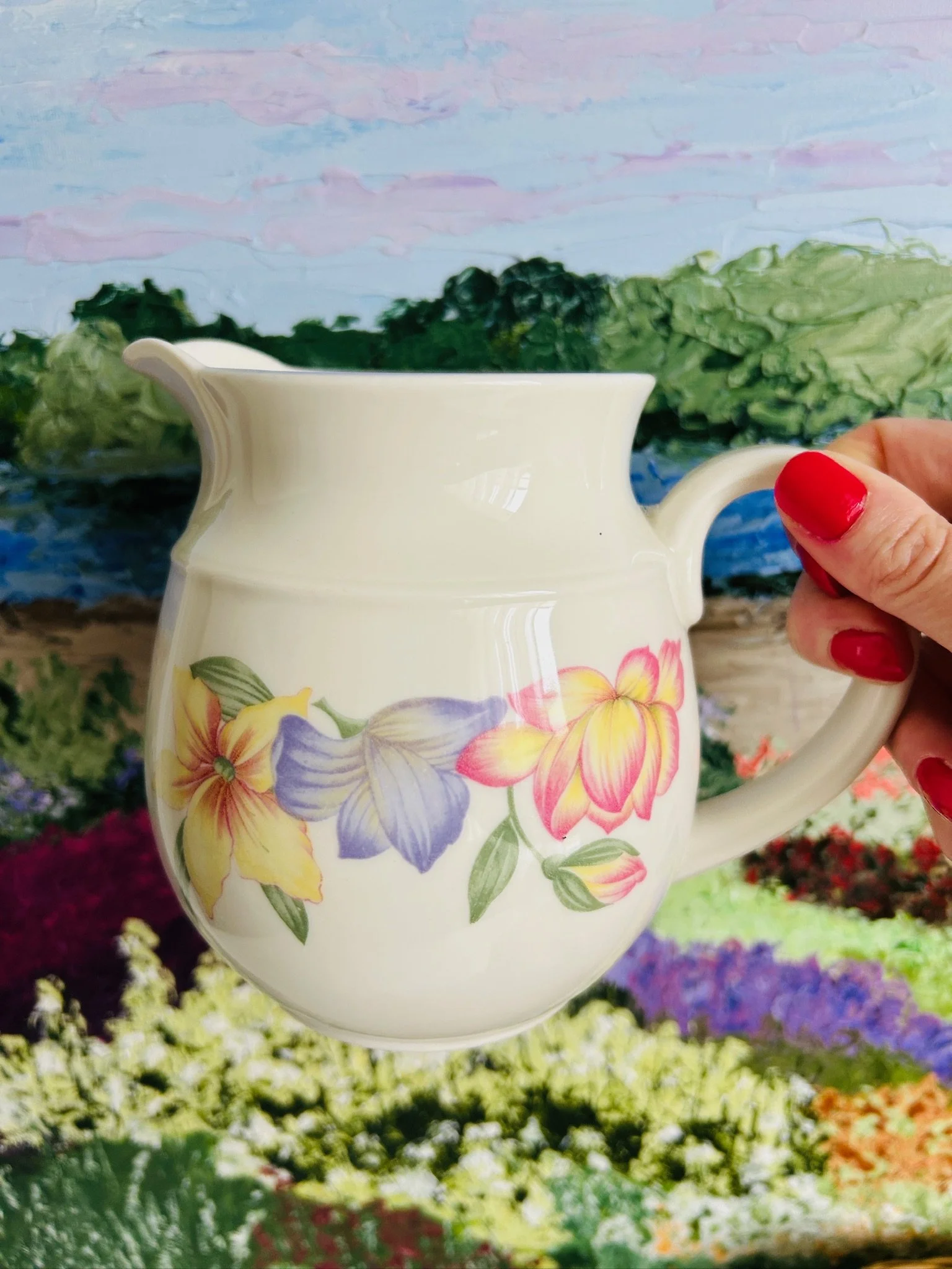 Close-up of the floral design featuring yellow, purple, and pink blooms