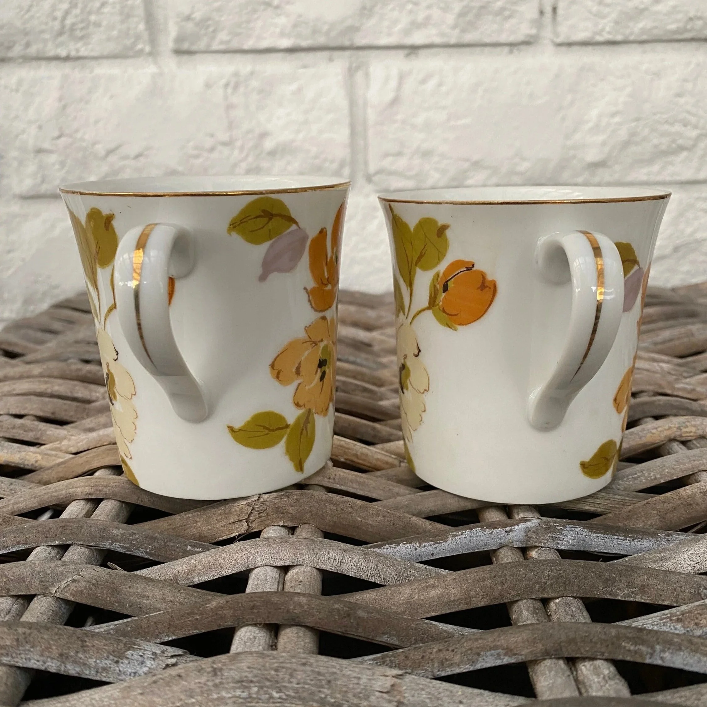 Rear view showing cup handles and smooth porcelain finish