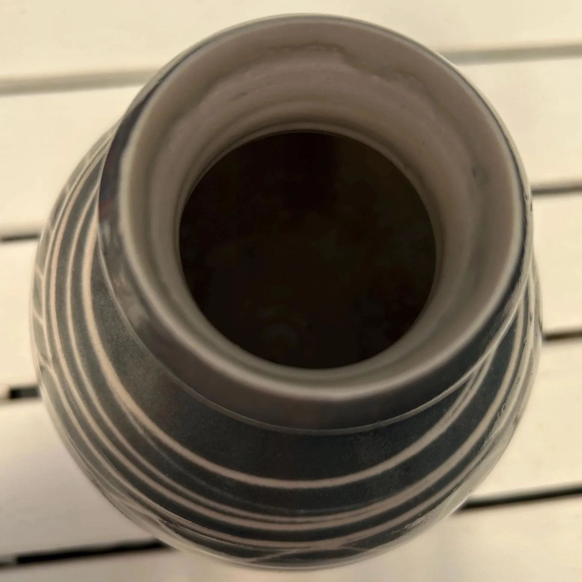 Top view showing narrow mouth and smooth glazed interior