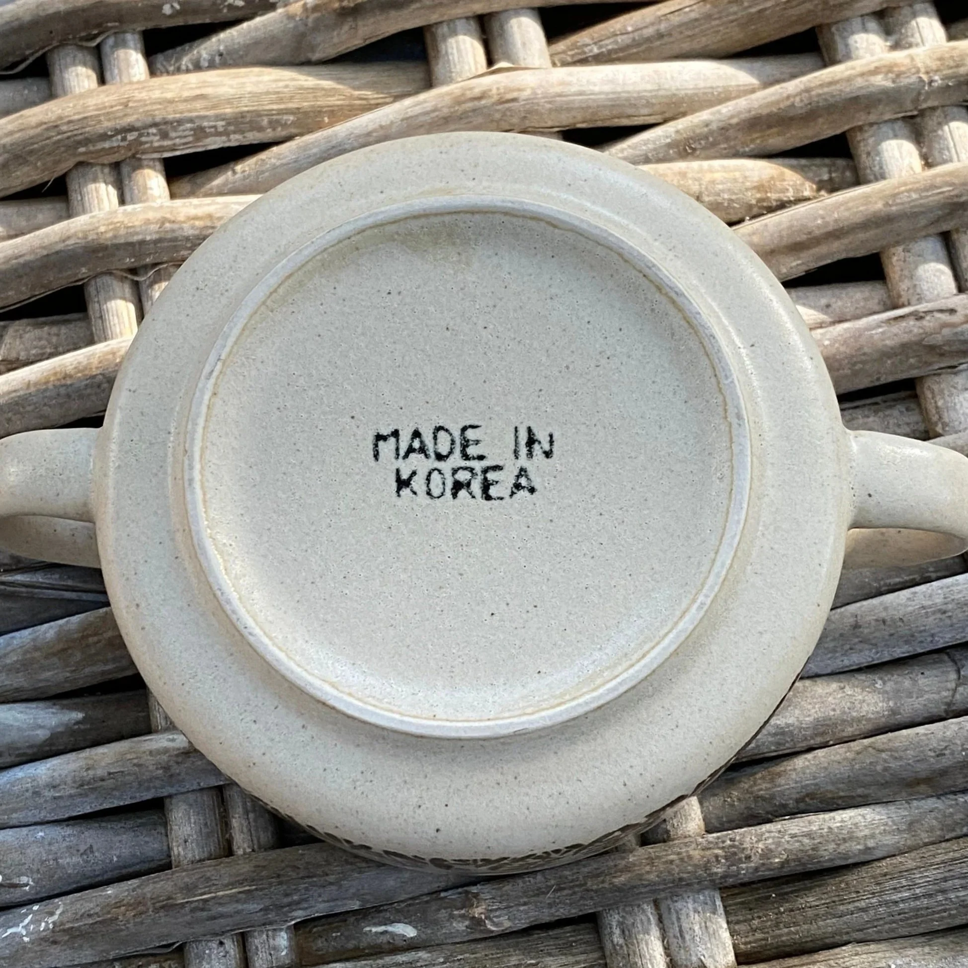 Underside of mug showing "Made in Korea" stamp