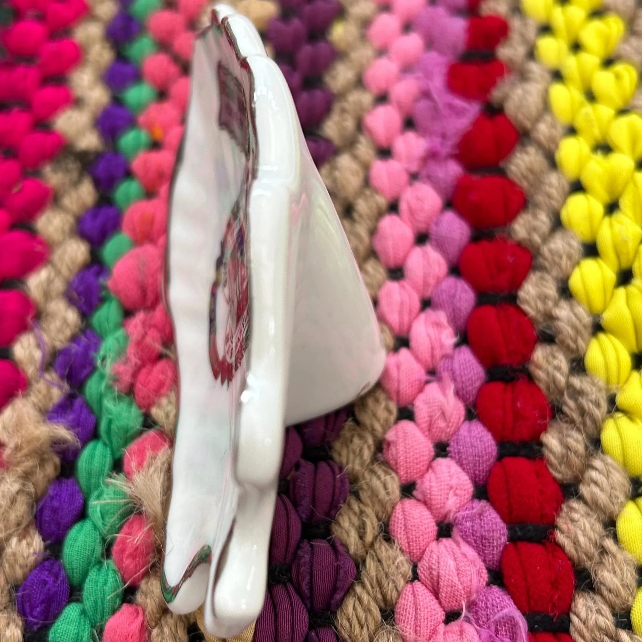 Side profile showing depth and curve of porcelain dish