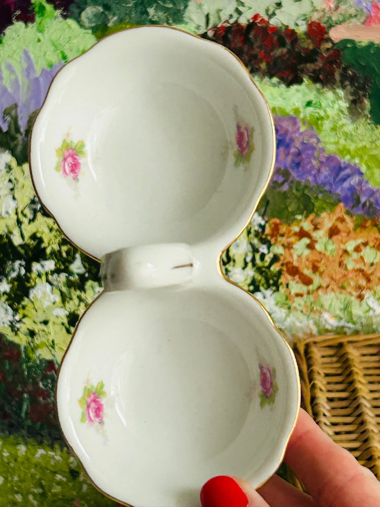 Top-down view of both bowls showing the pink rose motifs inside each side