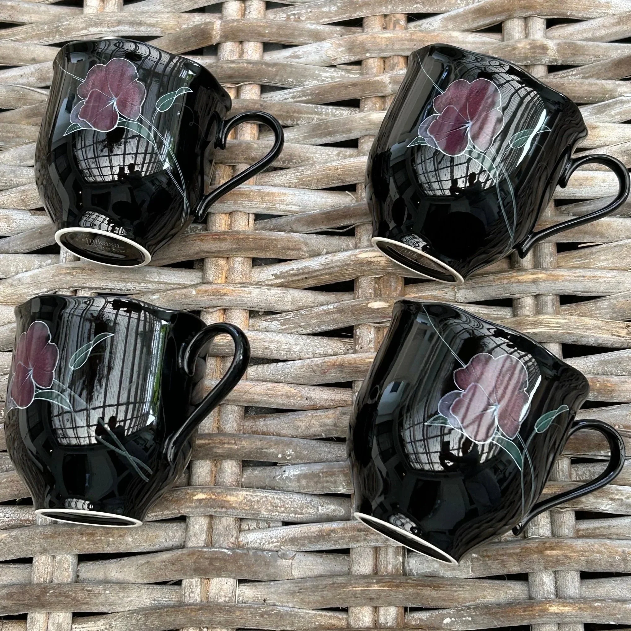 Overhead view of four Mikasa Rondo Tango mugs laid out on wicker