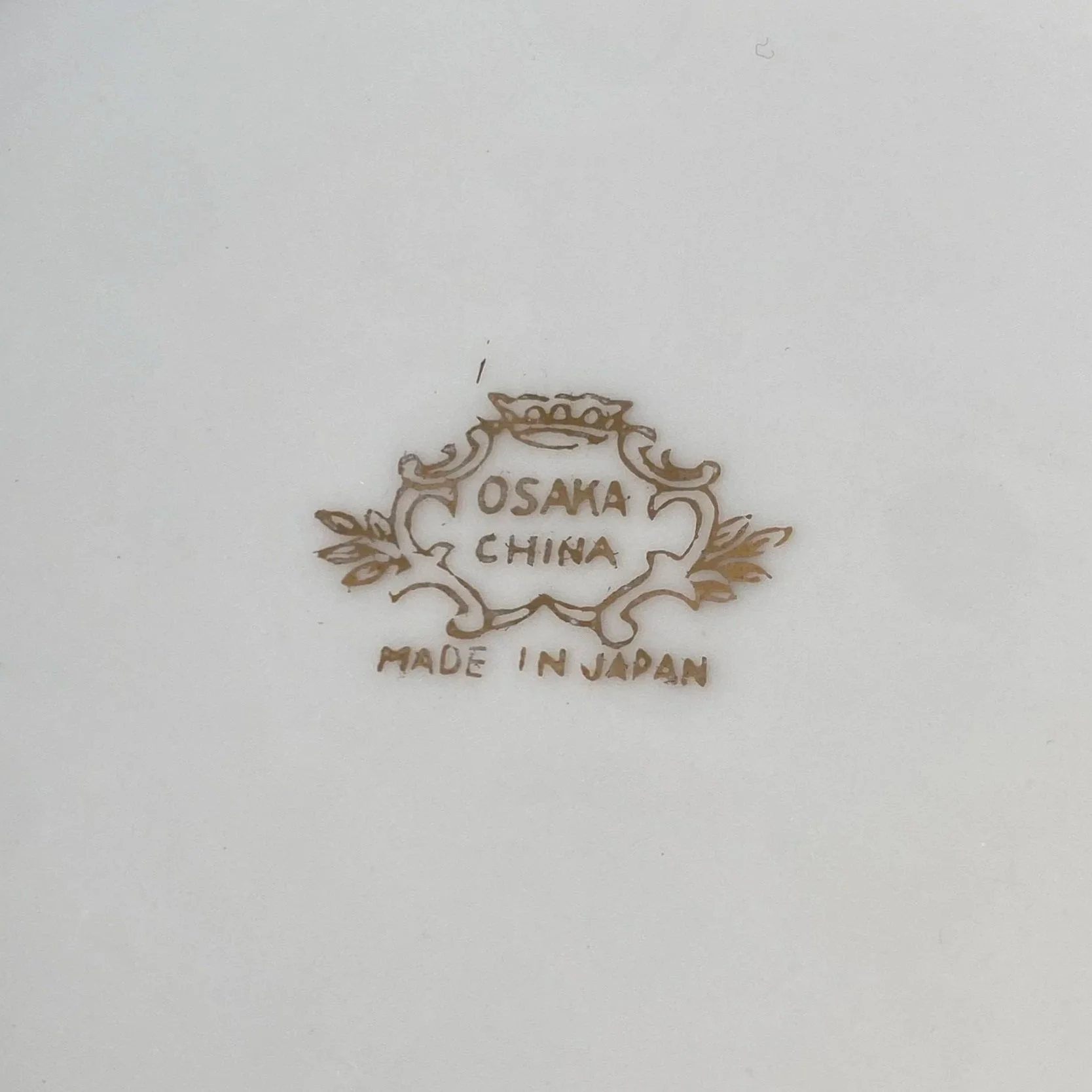 Close-up of Osaka China maker’s mark reading “Made in Japan”