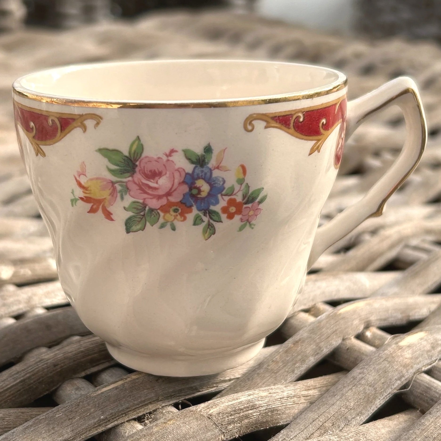 Side angle of one cup showing rim detail and slight crazing