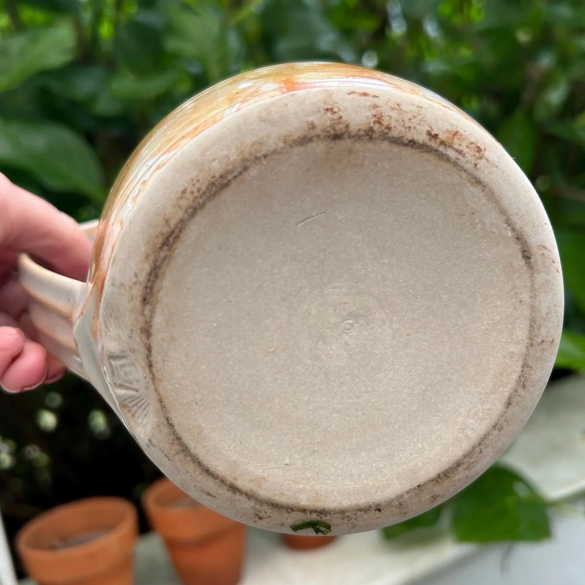 Bottom of jug showing unglazed base and natural clay colour
