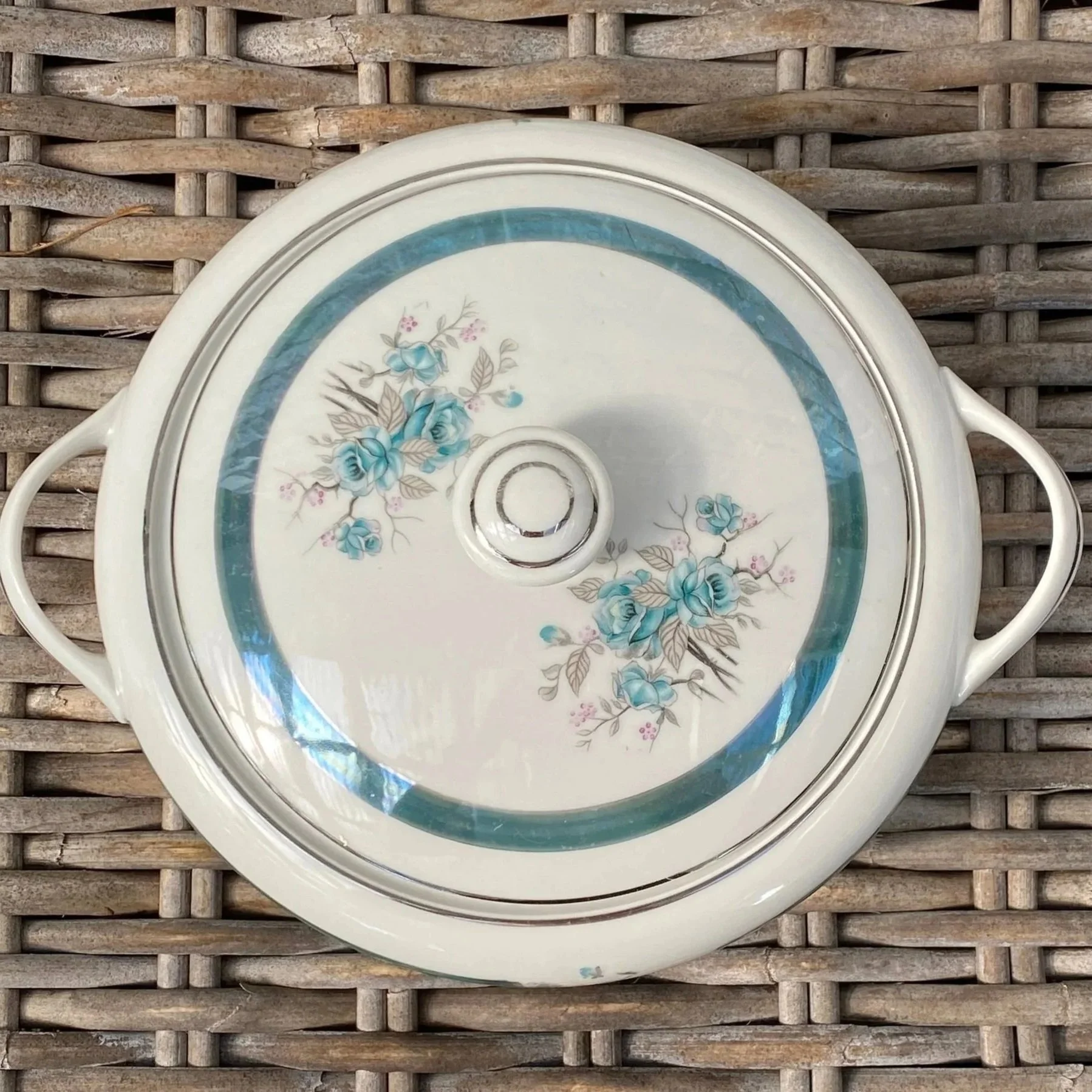 Top view of tureen lid showing teal band and floral decoration