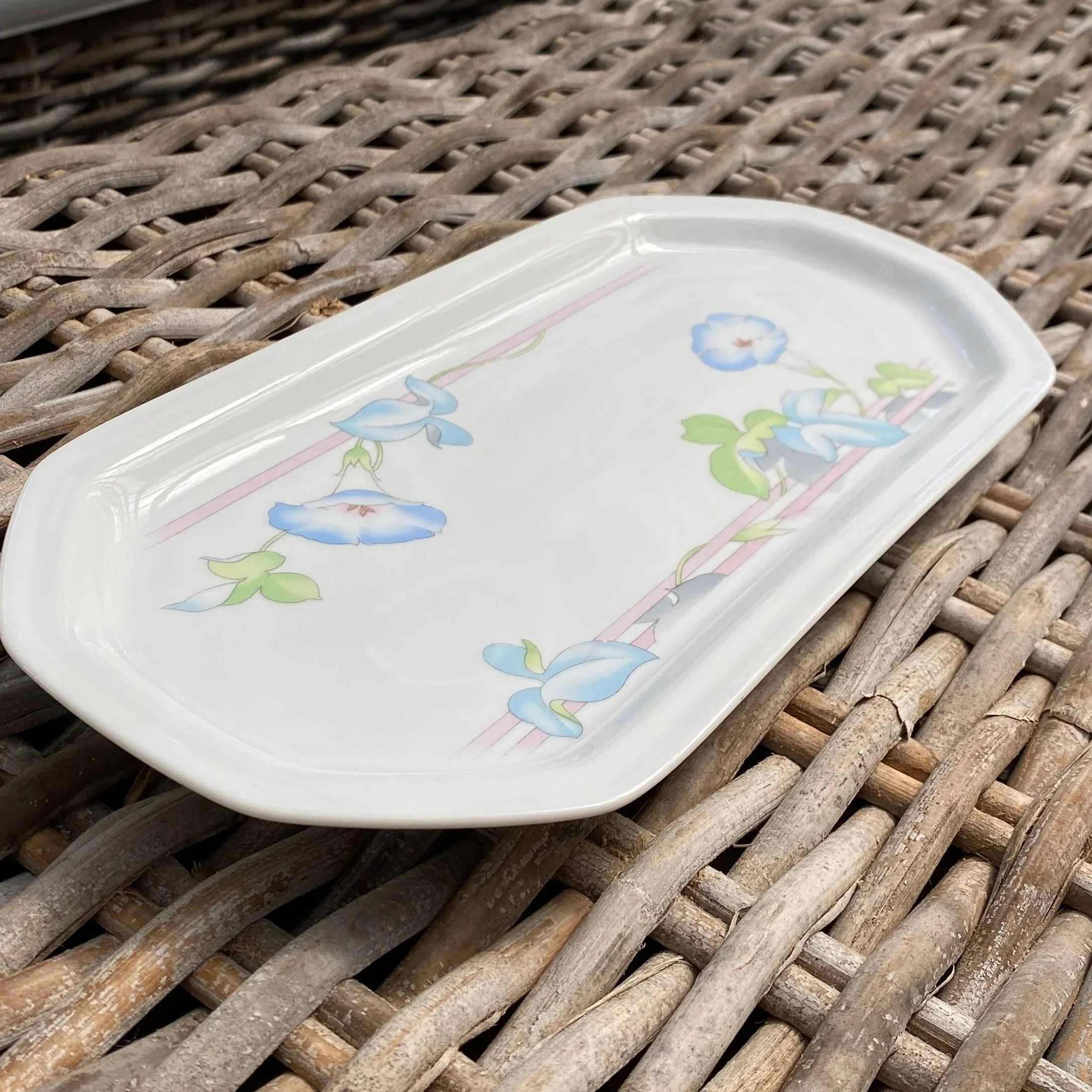 Vintage Westbury bread serving platter shown at an angle, featuring a delicate blue floral morning glory design