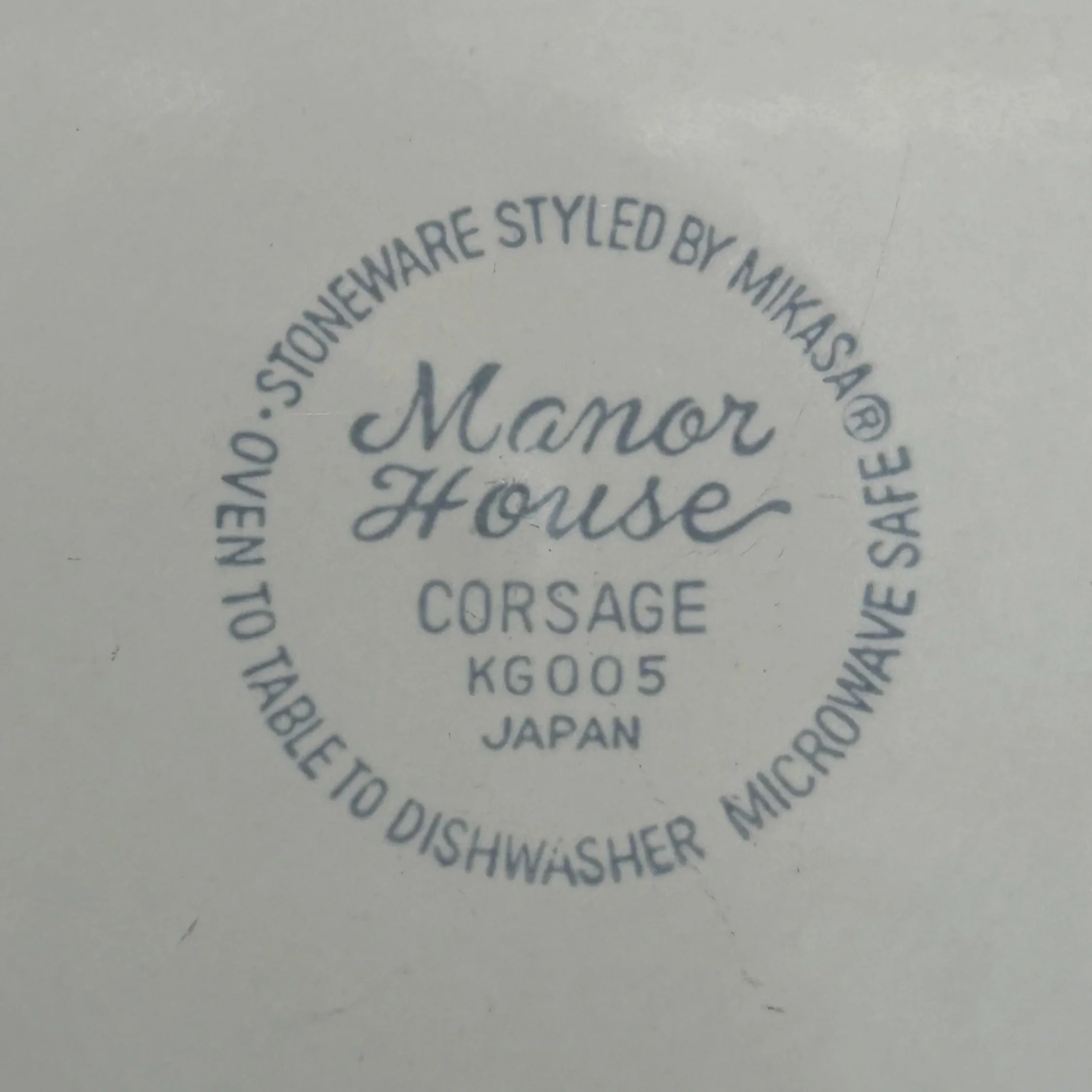 Underside mark reading “Manor House Corsage KG005 Japan”