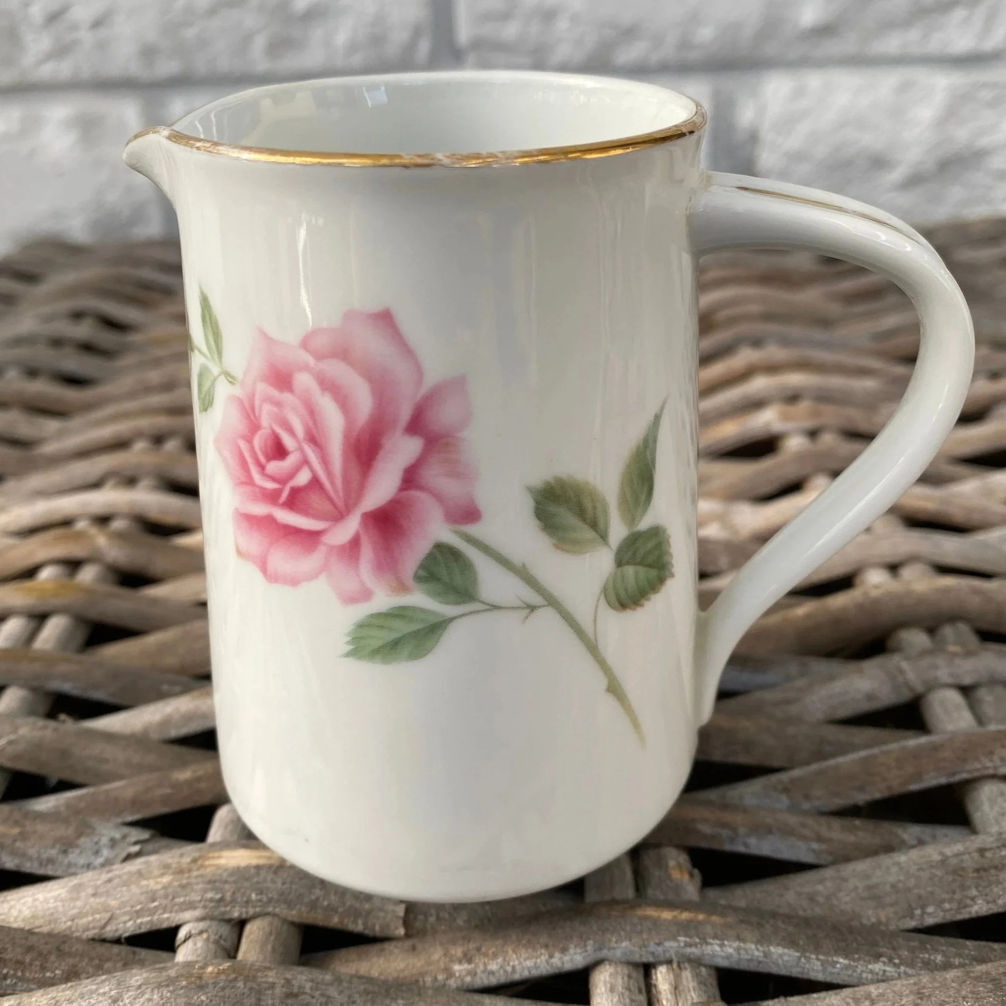 Full side view of Noritake porcelain creamer with pink rose motif