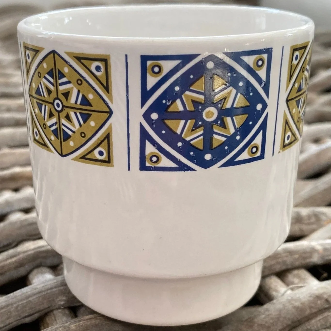 Pattern detail focusing on cobalt blue and mustard yellow geometric design